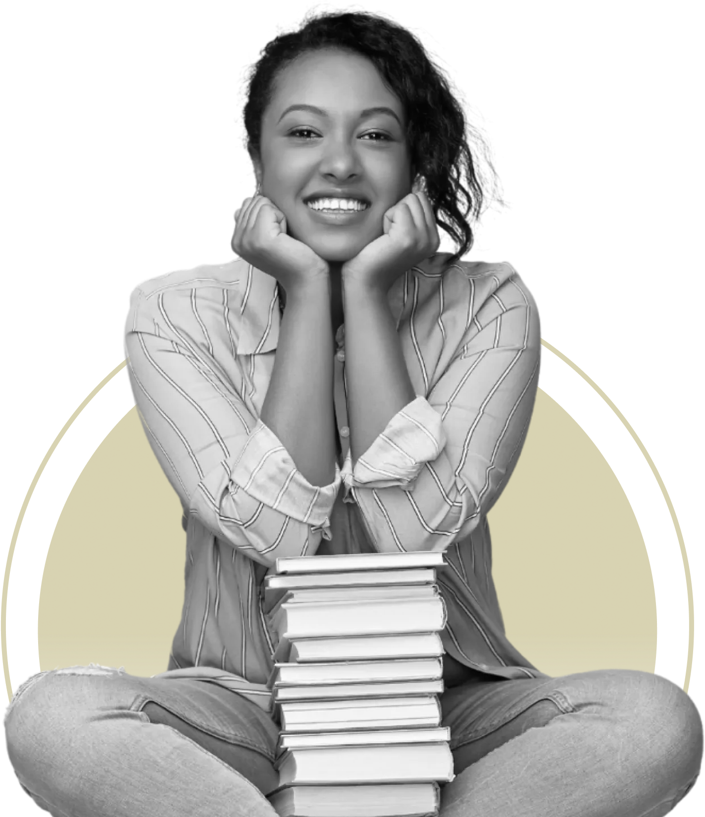 A smiling person sits cross-legged, resting their chin on hands placed over a stack of books.